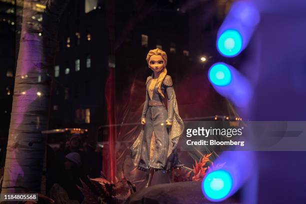 Doll of Walt Disney's "Frozen II" fictional character Elsa stands in a window display during the Saks Fifth Avenue Inc. Holiday window unveiling...
