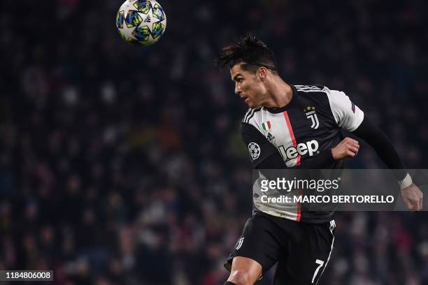 Juventus' Portuguese forward Cristiano Ronaldo goes for a header during the UEFA Champions League Group D football match Juventus Turin vs Atletico...