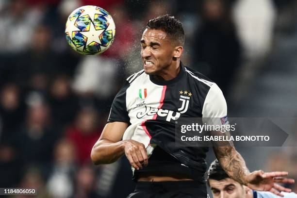 Juventus' Brazilian defender Danilo goes for a header during the UEFA Champions League Group D football match Juventus Turin vs Atletico Madrid on...