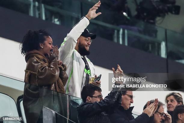 Barbadian singer Rihanna and her brother Rorrey Fenty attend attends the UEFA Champions League Group D football match Juventus Turin vs Atletico...