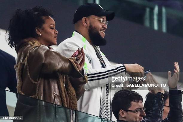 Barbadian singer Rihanna and her brother Rorrey Fenty attend attends the UEFA Champions League Group D football match Juventus Turin vs Atletico...