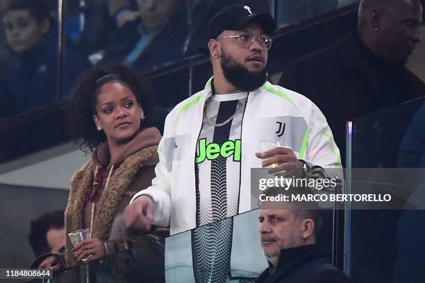 Barbadian singer Rihanna and her brother Rorrey Fenty attend the UEFA Champions League Group D football match Juventus Turin vs Atletico Madrid on...