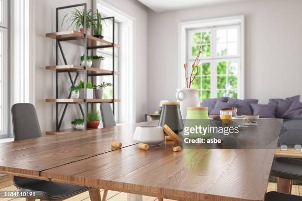 holztischplatte mit unschärfe des modernen wohnzimmer-interieurs - kitchen bench wood stock-fotos und bilder