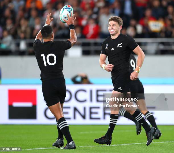 Beauden Barrett of New Zealand celebrates with Richie Mo'Unga as he scores his team's second try during the Rugby World Cup 2019 Bronze Final match...