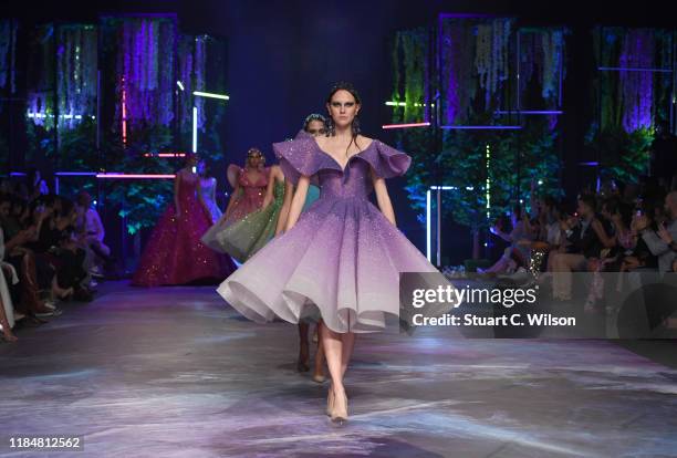 Model walks the runway at the Michael Cinco show during the FFWD October Edition 2019 at the Dubai Design District on October 31, 2019 in Dubai,...