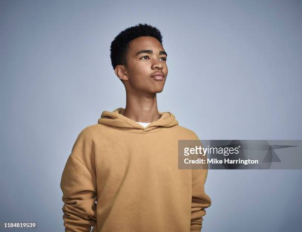 portrait of young black male - camel colored photos et images de collection