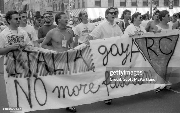 Gay rights activists from Italy carry a banner that reads 'Italia Gay ARC, No More Fascism' as they march down Central Park South during the Gay...