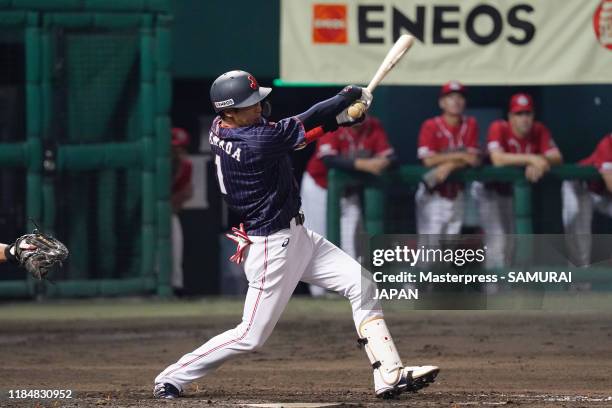 Infielder Tetsuto Yamada of Japan hits a RBI single to make it 2-0 in the top of 5th inning during the game two between Samurai Japan and Canada at...