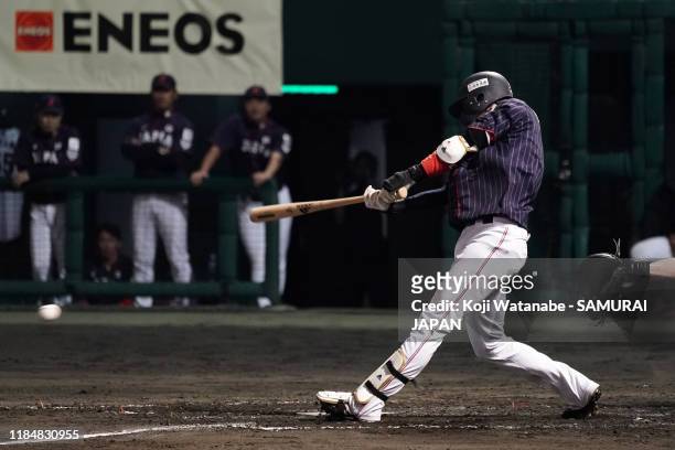 Infielder Tetsuto Yamada of Japan hits a RBI single to make it 2-0 in the top of 5th inning during the game two between Samurai Japan and Canada at...