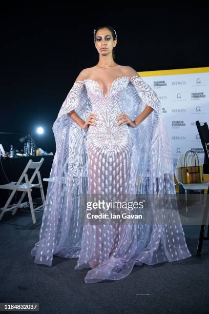 Model backstage ahead of the Michael Cinco show during the FFWD October Edition 2019 at the Dubai Design District on October 31, 2019 in Dubai,...