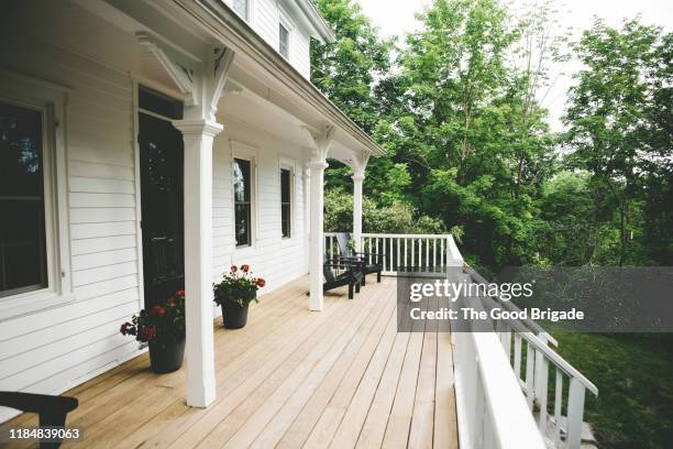 exterior shot of front porch at old farmhouse - front porch no people stock pictures, royalty-free photos & images