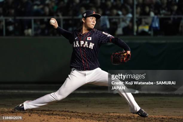 Pitcher Yoshinobu Yamamoto of Japan throws in the bottom of 8th inning during the game two between Samurai Japan and Canada at the Okinawa Cellular...
