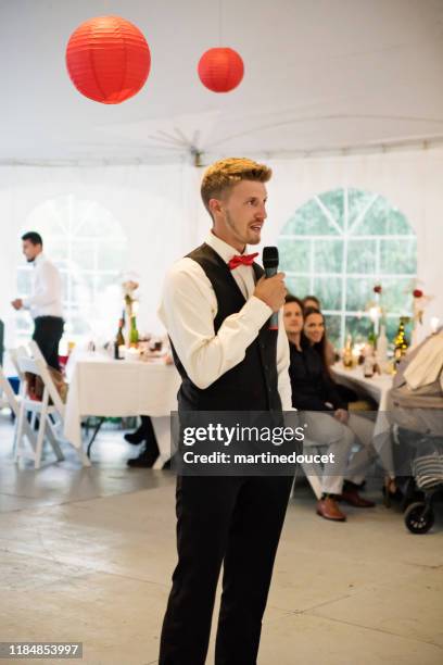 best man's speech at the table of honour at wedding reception. - best man stock pictures, royalty-free photos & images