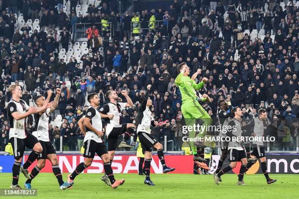 Juventus' Dutch defender Matthijs de Ligt , Juventus' Portuguese forward Cristiano Ronaldo , Juventus' Polish goalkeeper Wojciech Szczesny and...