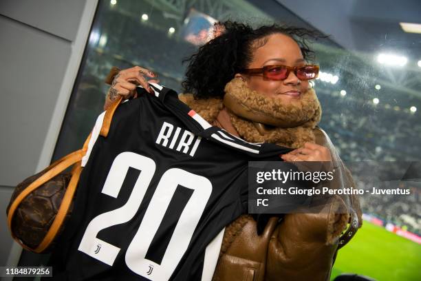 Singer Rihanna with Juventus' t-shirt attends the UEFA Champions League group D match between Juventus and Atletico Madrid at Allianz Stadium on...