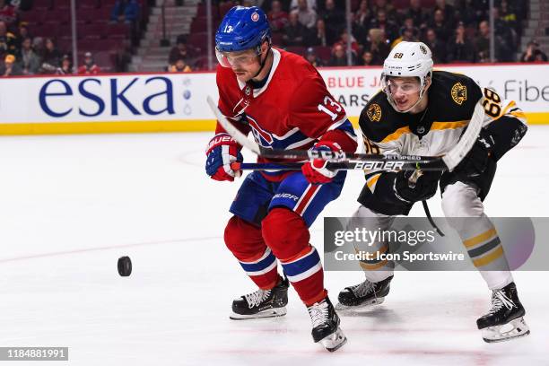 Montreal Canadiens center Max Domi chases the puck while Boston Bruins center Jack Studnicka is behind him during the Boston Bruins versus the...