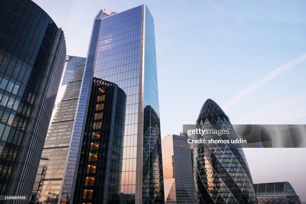 Looking up at futuristic London skyscrapers