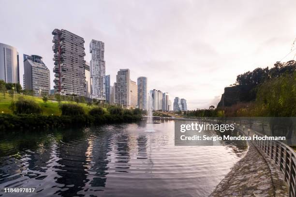 la mexicana park and the buildings of santa fe - mexico city - mexico city park stock pictures, royalty-free photos & images