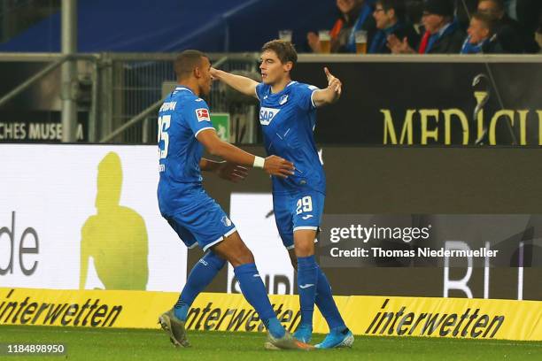 Robert Skov of Hoffenheim celebrates his goal with Kevin Akpoguma of Hoffenheim during the Bundesliga match between TSG 1899 Hoffenheim and SC...