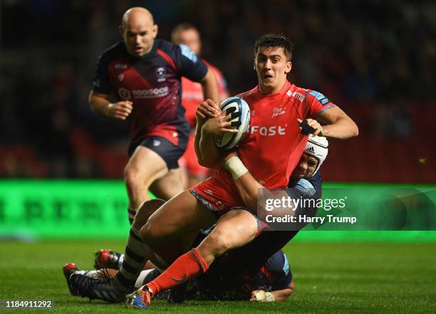 Cameron Redpath of Sale Sharks looks to break past the tackle from Dave Attwood of Bristol Bears during the Gallagher Premiership Rugby match between...