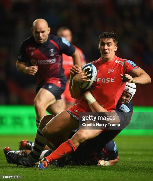 Cameron Redpath of Sale Sharks looks to break past the tackle from Dave Attwood of Bristol Bears during the Gallagher Premiership Rugby match between...