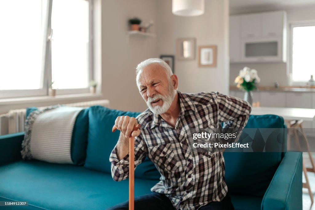 Elderly Man suffers from Back Pain