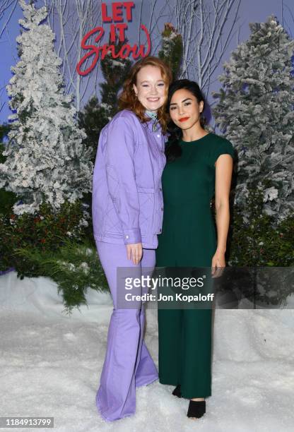 Liv Hewson and Anna Akana attend the photocall for Netflix's "Let It Snow" at the Beverly Wilshire Four Seasons Hotel on November 01, 2019 in Beverly...