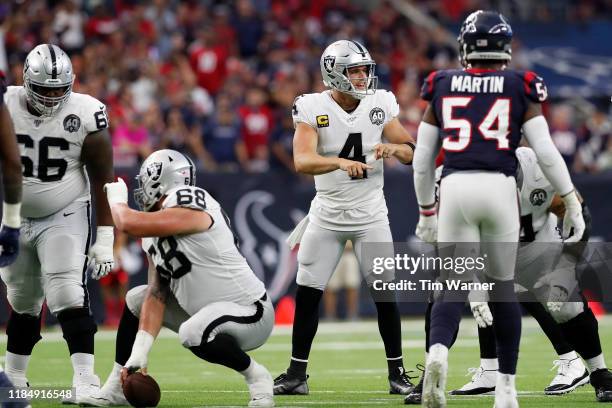 Derek Carr of the Oakland Raiders signals at the line of scrimmage in the second half against the Houston Texans at NRG Stadium on October 27, 2019...