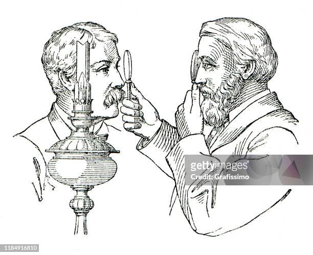 doctor examining with ophthalmoscope interior of eye 1896 - old fashioned doctor stock illustrations