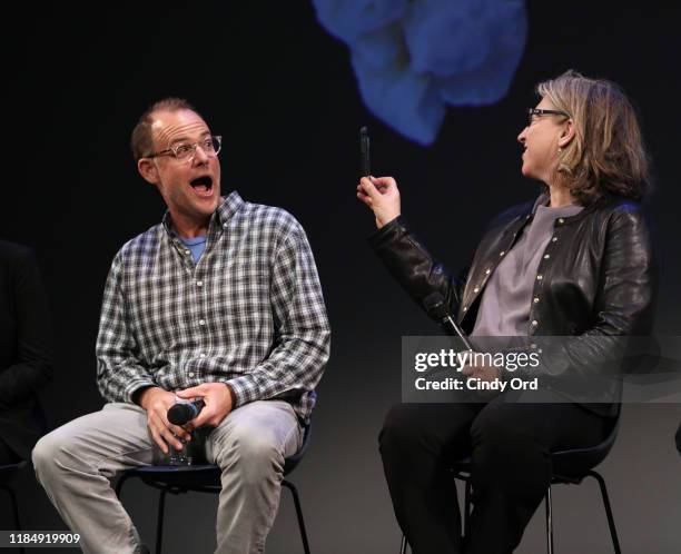 John Chester and Lauren Greenfield take selfies onstage at the Docs To Watch Roundtable during the 22nd SCAD Savannah Film Festival on November 01,...