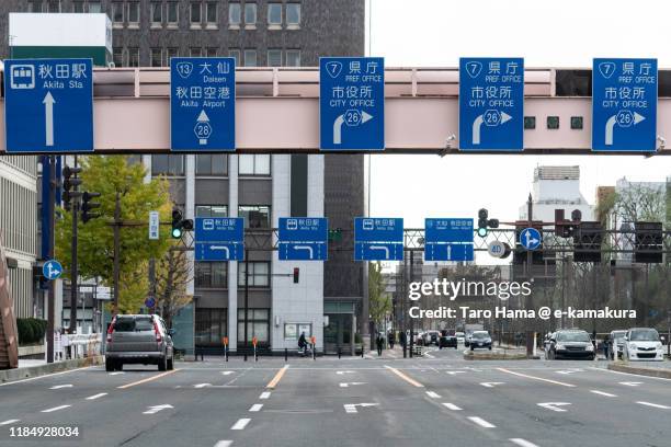 road direction board over city road in akita city in japan - tottori prefecture - fotografias e filmes do acervo