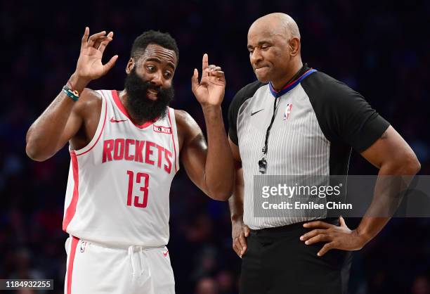 James Harden of the Houston Rockets talks to official Marat Kogut during the first half of their game against the Brooklyn Nets at Barclays Center on...