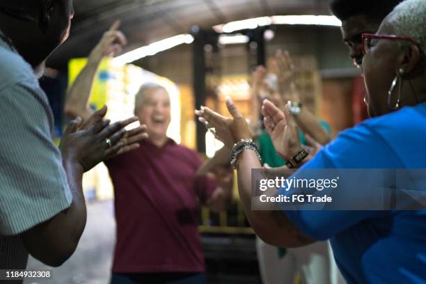 happy employees celebrating together at warehouse - applauding staff stock pictures, royalty-free photos & images