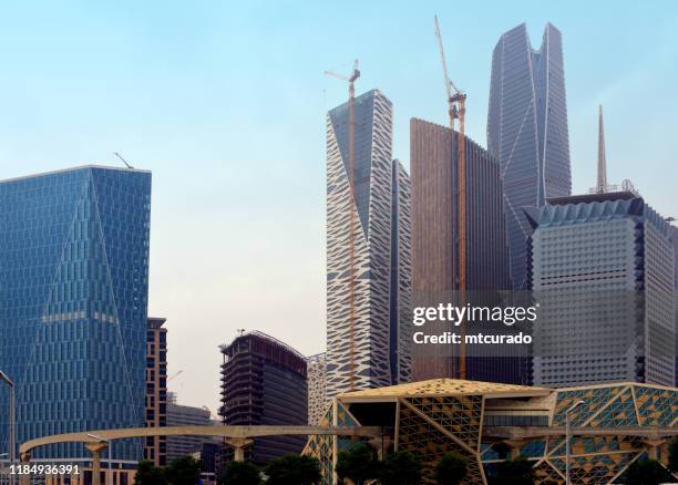 king abdullah financial district (kadf) skyscrapers and monorail, al aqeeq, riyadh, saudi arabia - al riad stock pictures, royalty-free photos & images