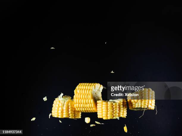 corn cob cutted flying in mid air with high speed sync. - husk stockfoto's en -beelden