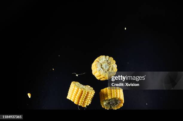 corn cob cutted flying in mid air with high speed sync. - husk stock-fotos und bilder