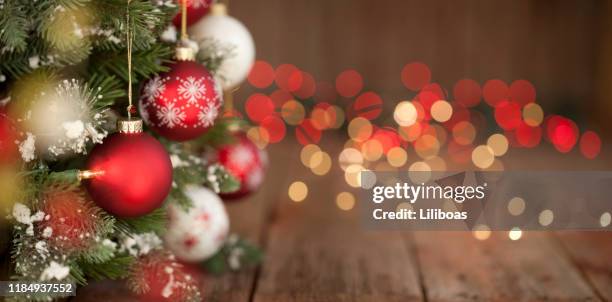 christmas tree, ornaments and defocused lights background - draped table stock pictures, royalty-free photos & images