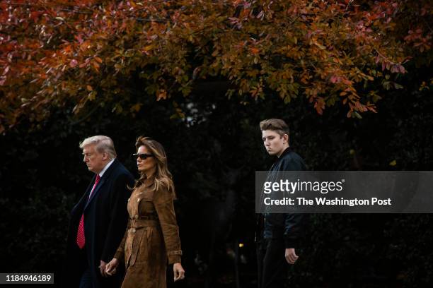 President Donald J. Trump, First Lady Melania Trump, and Barron Trump walk from the Oval Office to board Marine One and depart from the South Lawn at...