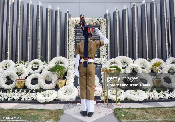 Police personnel salutes the martyrs of the 26/11 Mumbai terror attack at the Police Memorial site, on November 26, 2019 in Mumbai, India.