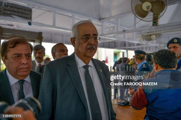 Pakistan's Attorney-General Anwar Mansoor Khan leaves the Supreme Court building after a case hearing suspending the notification of the tenure...