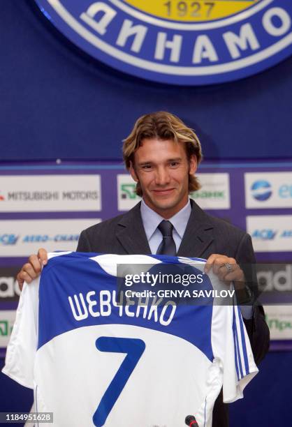 New player of FC Dynamo Kiev Ukrainian Andriy Shevchenko holds up his new jersey during his presentation at Valeriy Lobanovsky stadium in Kiev on...