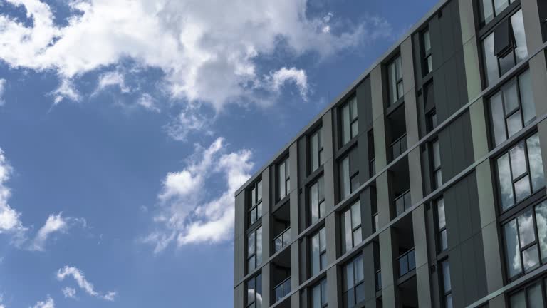 https://media.gettyimages.com/id/1184956845/video/time-lapse-of-apartment-buildings-reflecting-white-clouds-moving-past-clear-sky-to-storm.jpg?b=1&s=640x640&k=20&c=4BtwG72b9t6jdBr6Wf0zzLHIxJ-KZsr3V39ZJkKqDTI=