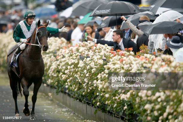 Dwayne Dunn on Exceedance returns to scale after winning race 6 the Coolmore Stud Stakes during 2019 Derby Day at Flemington Racecourse on November...