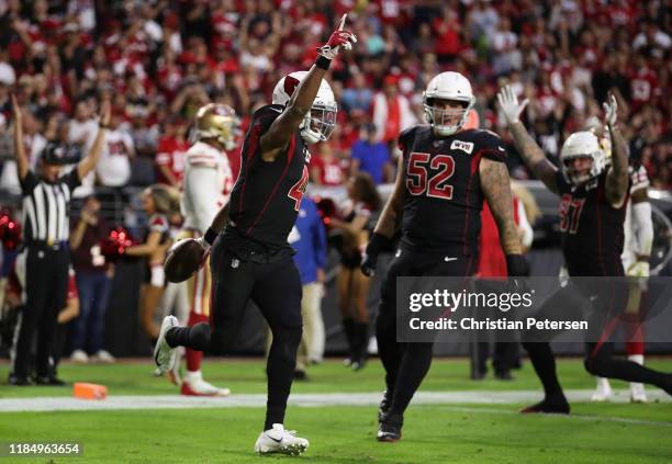 Running back Kenyan Drake of the Arizona Cardinals reacts to scoring a rushing touchdown against the San Francisco 49ers during the first half of the...