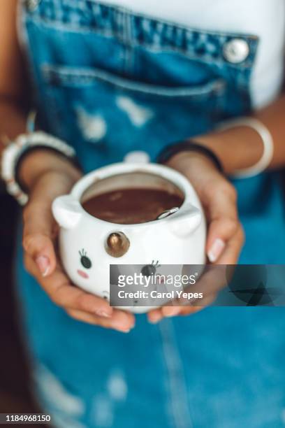hand holding hot chocolate cup - hot spanish women stock pictures, royalty-free photos & images