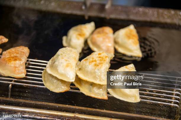 korean street food, fried dumplings in myeong-dong, seoul korea - south stand fotografías e imágenes de stock