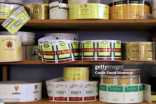 Wine labels are seen during a visit to Maison Joseph Cattin winery on October 11, 2019 in the village of Voegtlinshoffen in the Alsace region of...