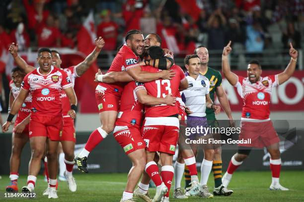 Tonga celebrate their win over Australia during the Rugby League International Test match between the Australia Kangaroos and Tonga at Eden Park on...