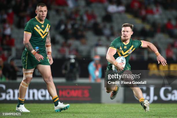 Damien Cook of Australia makes a break during the Rugby League International Test match between the Australia Kangaroos and Tonga at Eden Park on...