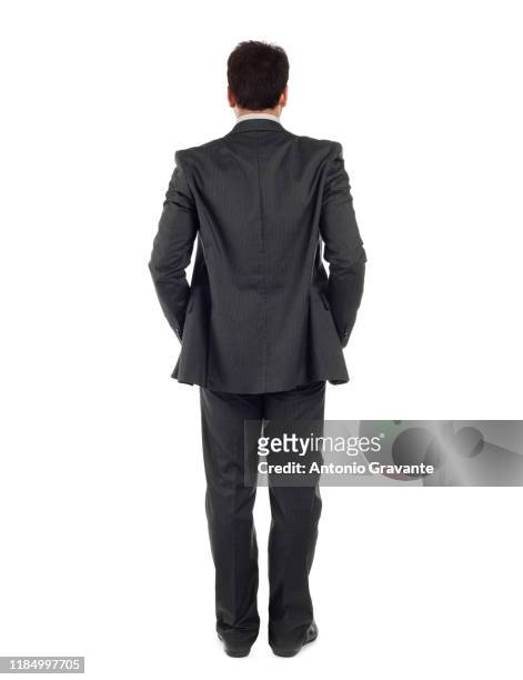 rear view of businessman standing against white background - solo un uomo di età media foto e immagini stock